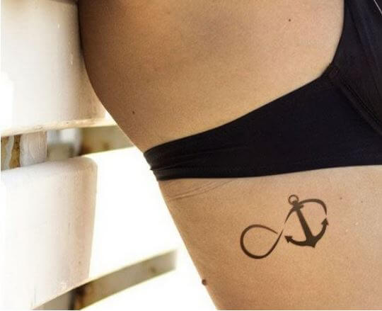 Woman With Infinity Symbol And Anchor Tattoo