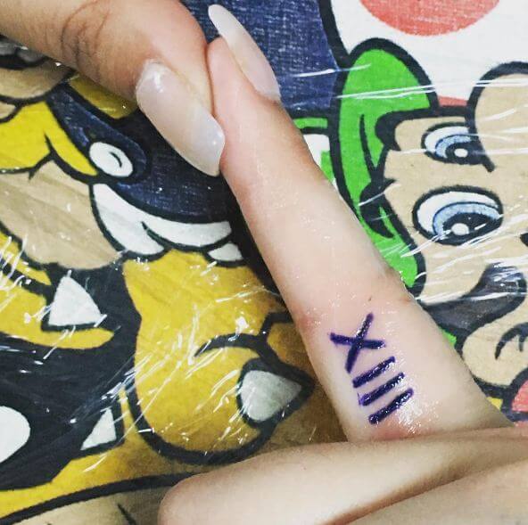 Roman Numeral Tattoos On Finger
