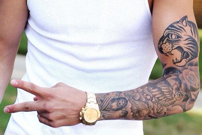 Justin Bieber's Koi Fish Tattoo on His Arm- PopStarTats