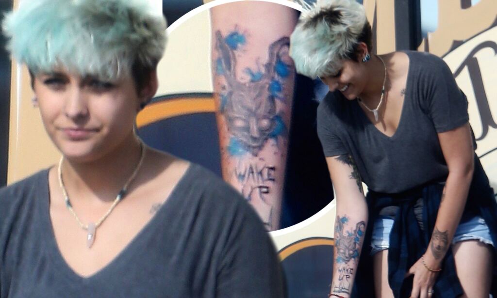EXCLUSIVE PICTURES nnJun 12 2016nnParis Jackson Shows Off Her New Tattoo As She Smokes A Cigarette Outside The Tattoo Parlor In Los Angeles On Sunday Afternoon.nnThe Daughter Of Michael Jackson Kept Up Her Wild Image With The Tattoo Of The Demon Rabbit From Donnie Darko With The Words Wake Up Below It.nnThem Seven Year Anniversary Of Her Dad Michael's Death Is Next Week, On June 29th.nnCredit Line Must Read: Lemon Light Media.com